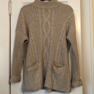 Oversized cream knit sweater with pockets